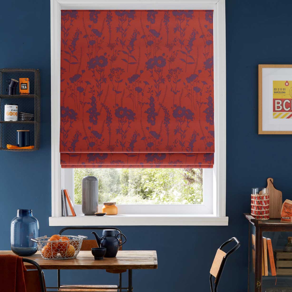 Red and purple floral print Roman Blinds in navy kitchen